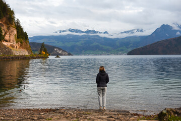 Fototapeta na wymiar blonde girl enjoying view over lake lucerne