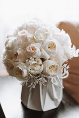 Morning groom and details, details of the groom brown. wedding details, gold wedding rings. Wedding accessories. Bouquet and accessories of bride and groom. Wedding details