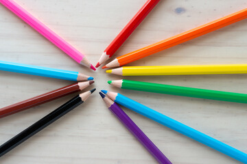 Fototapeta premium set of colored pencils with freedom or rainbow colors on tracing paper and wood