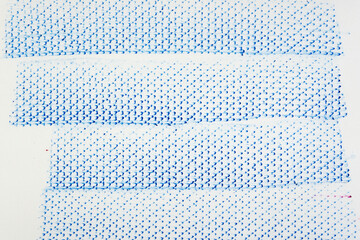 frottage technique featuring a grid or net pattern on tracing paper and photographed on a white backlit surface
