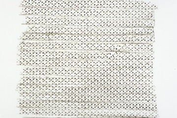 frottage technique featuring a grid or net pattern on tracing paper and photographed on a white...