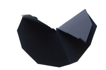 folded black paper shape on a white background