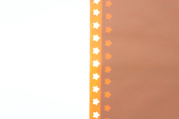 Fototapeta premium yellow/brown paper with star border edge and blank space for copy