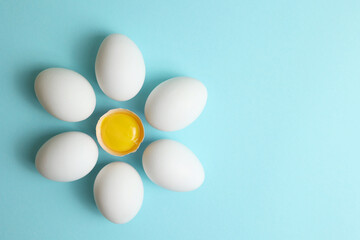 fresh farm chicken eggs on a colored background