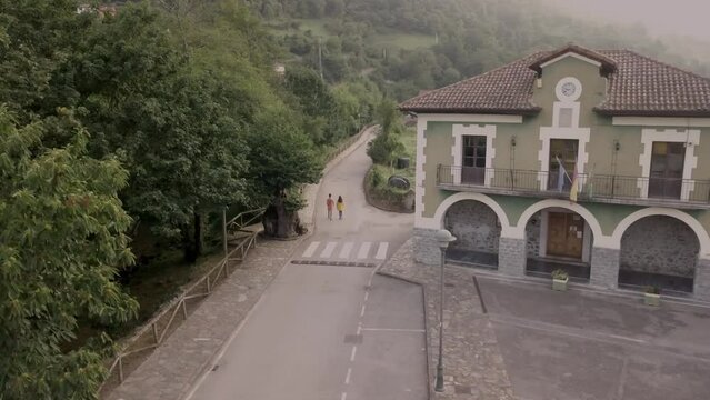 Asturias Senda del Oso, diverse couple trekking travel in nature. Aerial drone scenic view