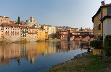 Fototapeta na wymiar View of Bassano del Grappa, Italy, its historic buildings and its famous bridge over river Brenta
