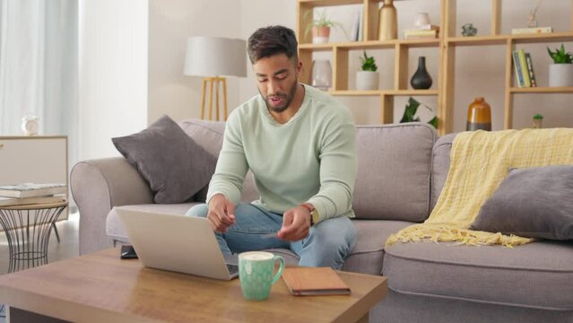 Laptop, credit card and online shopping with a man cheering in his home during ecommerce for a sale or deal. Computer, payment and celebration with a young customer happy about financial freedom