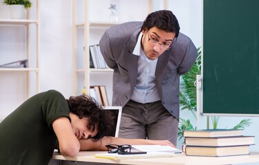 Fototapeta premium Young teacher and student in the classroom