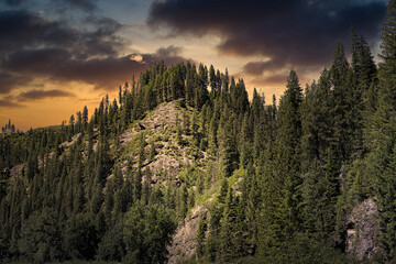 2021-06-14 A ROCKY HILLSIDE WITH TREES AND A STORMY SUNSET OUTSIDE OF COEUR D'ALENE IDAHO