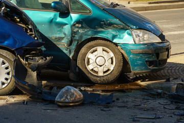 Car accident. A broken-down passenger car is on the road after an accident. Road sign of an emergency stop. Accident insurance on the road.