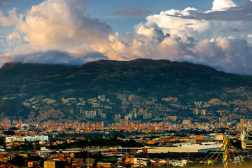 Hill with buildings in Medellin, Colombia, during sunset