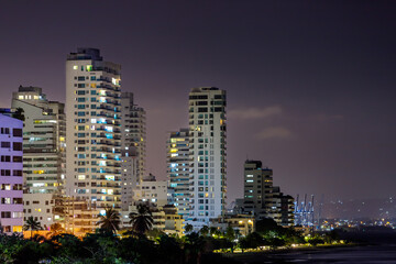 Fototapeta na wymiar Panoramic night view of buildings with port in the background in Cartagena de Indias, Colombia