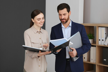 Businesspeople working together with documents in office