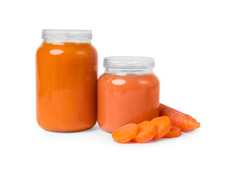 Jars of healthy baby food and carrot slices on white background