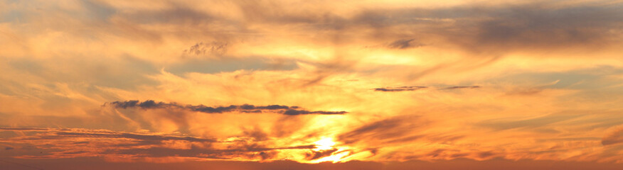 Sun shining through beautiful cloudy sky at sunset, banner design