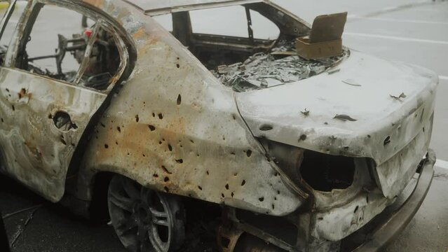 Holes from shrapnel in the body of a civilian car. Ukraine. Bucha 2022