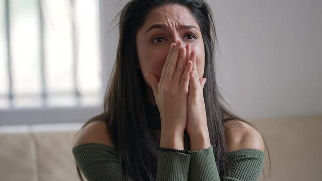 One desperate young woman crying in frustration and regret. Anxious adult girl in 20s suffering from emotion pain