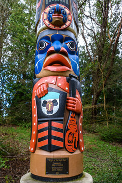 SEATTLE, WA, USA – MARCH 23, 2023: Washington Park Arboretum, northwest coast native American totem pole carving, Origin of the Eagle Clan
