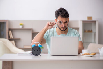Young male freelancer working from home