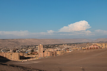 apartments in the city of Arica, in the background you can see the image of the desert