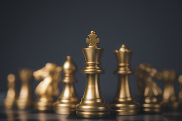 Chess board game, business competitive. Set of golden chess pieces.