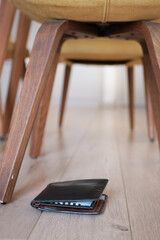  left wallet on floor at home 