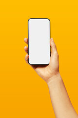 Close-up of woman hand holding modern smartphone iphone mockup. New modern black frameless smartphone mockup with blank white screen. high-quality studio shot, Modern smart phone
