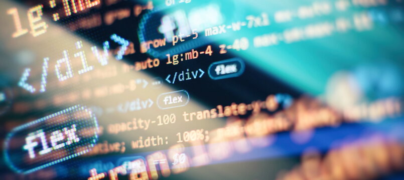 IT coding on monitor screen. Computer code data.