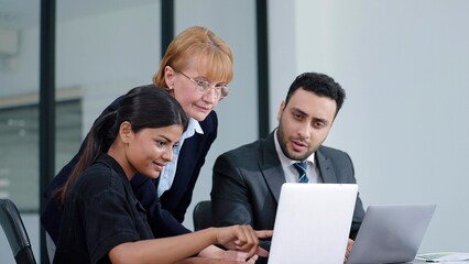 Businesswoman manager talking and disscussed brainstorming strategy of company growth with colleagues at boardroom meeting