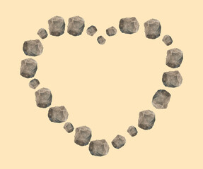 Heart made of stones isolated on light yellow background