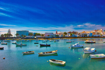 Fisher boats at the laguna Charco de San Gines at sunrise, city of Arrecife, Lanzarote, Canary...
