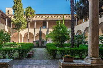 Convent of St. Augustine at San Gimignano town. View of the cloister walkway from the Convent entrance - San Gimignano, Siena province,Tuscany,Italy - June 2, 2021 - obrazy, fototapety, plakaty