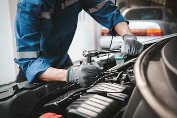 Car care maintenance and servicing, Hand technician auto mechanic using the wrench to fix car or...