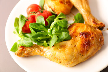 fried chicken leg with tomato and salad