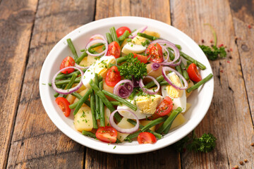 mixed vegetable salad with tomato, egg, bean and potatoes