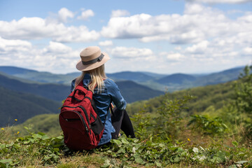 Freedom traveler woman on the top of mountains enjoy a wonderful nature. Yound girl on peak mountain with perfect view mountains. travel concept