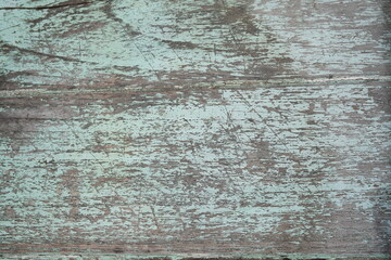 The light blue wooden table has been scratched over time for the background.