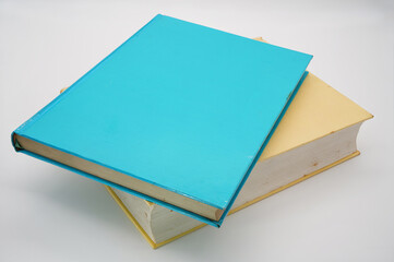 Blue and egg-colored thick book