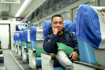 Photo of a young man on a Train in Surabaya 