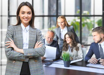 Group of business partners discussing ideas and planning work in office.