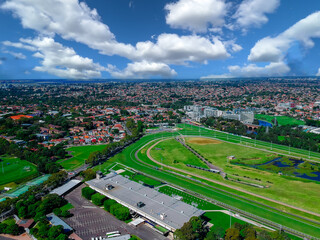 Panoramic Aerial Drone view of Suburban Sydney housing, roof tops, the streets and the parks NSW Australia