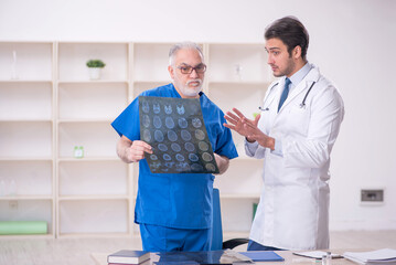 Two male doctors radiologists working in the clinic
