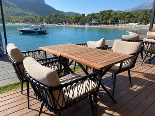 Fototapeta na wymiar Empty summer cafe on hill with sea beach view in sunny day,Antalya Turkey