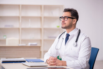 Young male doctor working in the clinic