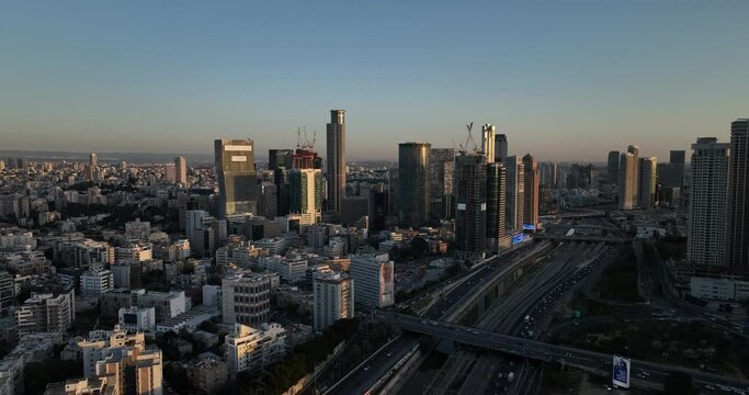 Aerial footage of the Ayalon road with the skyscrapers of Ramat Gan in the background. Filmed in C4K Apple ProRes 422 HQ