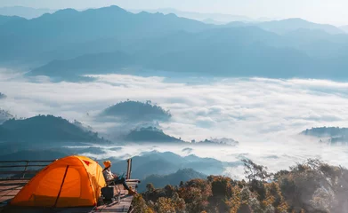 Fotobehang Asian traveller woman working by her homputer on the top of mon Kalakojo at Tak © anekoho