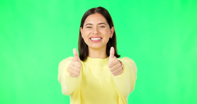 Happy woman, hands and thumbs up on green screen for winning, success or agreement against a studio background. Portrait of female with smile showing thumb emoji, yes sign or like on chromakey mockup