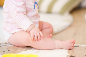 Obraz na płótnie Canvas Cute baby toddler feet on the floor