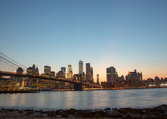 Fototapeta premium sunset new york city skyline with Brooklyn bridge