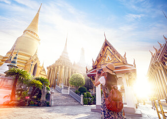 Asian woman traveller take a photo and travel in Bangkok grand palace and wat phra kaew in Bangkok...